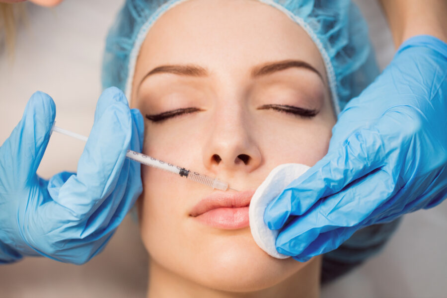 Hyaluronic acid injection in the lips performed by an aesthetic doctor